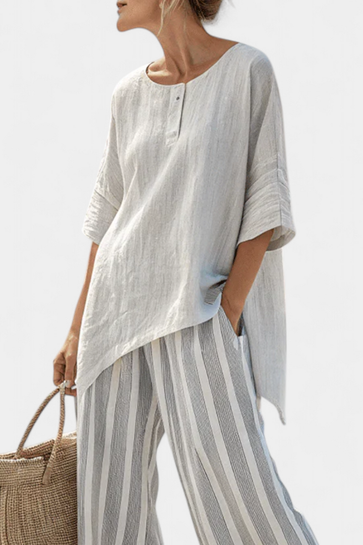 Fiorella – blusa asimmetrica elegante e pantaloni a righe